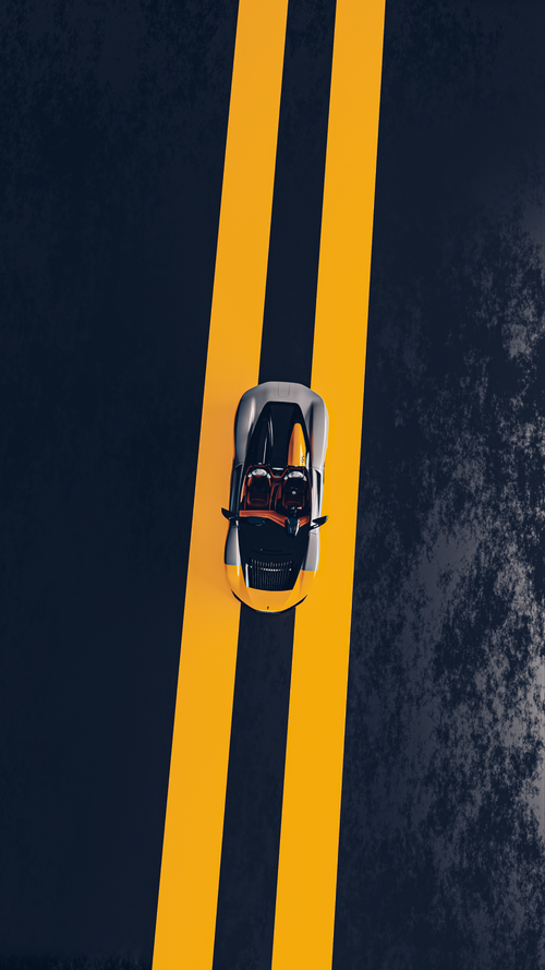 Free Top view of a sleek sports car driving on a double yellow line road. Stock Photo
