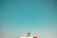 Minimalist Photo of a Rooftop Against Blue Sky