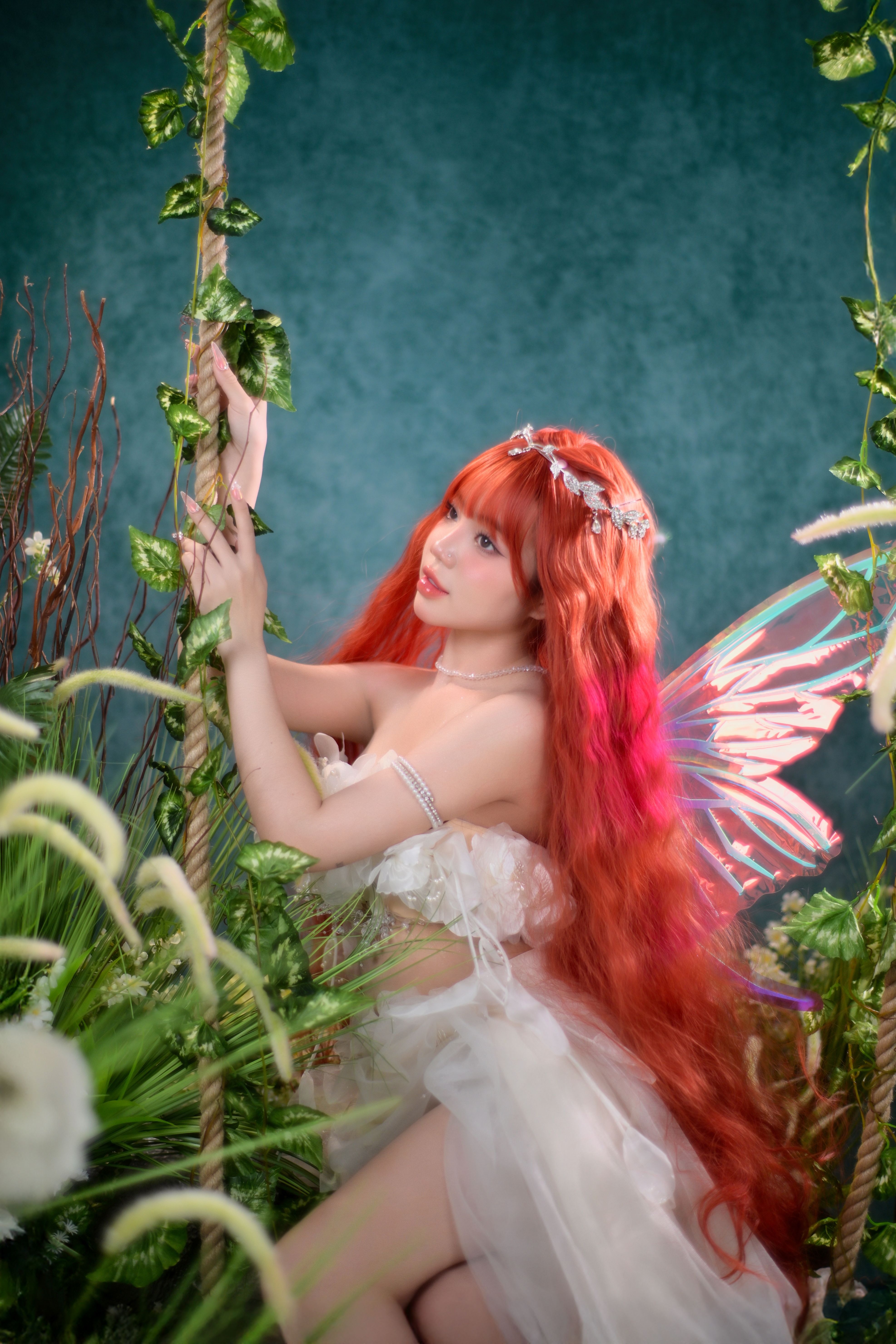 A captivating fairy with vibrant wings amidst a lush, magical forest.