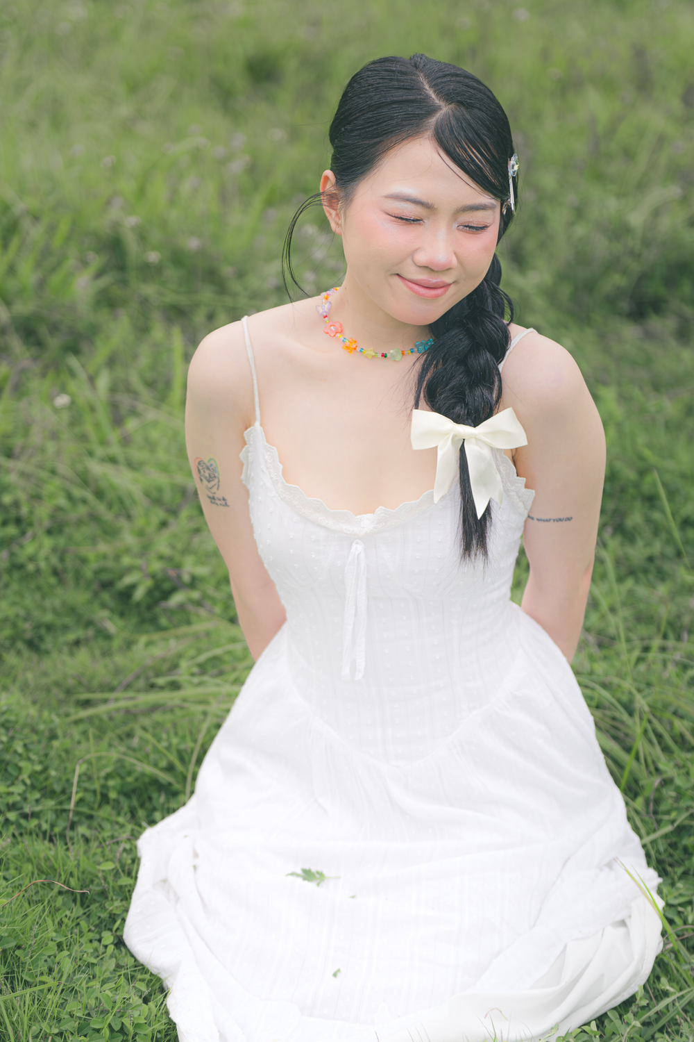 Young Woman in White Dress Sitting on Grass · Free Stock Photo