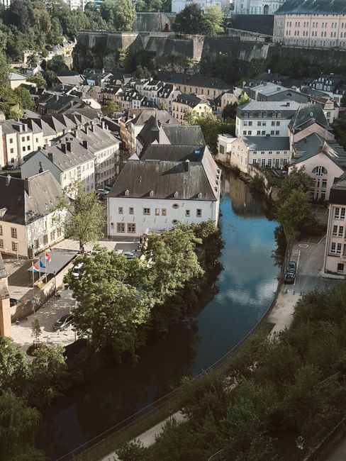 Capture of Luxembourg's charming cityscape with historic buildings and a river view.