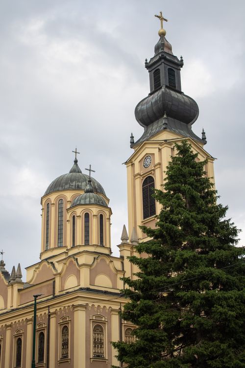 Free Beautifully captured Orthodox Church towers in Bosnia Herzegovina with lush greenery in the foreground. Stock Photo