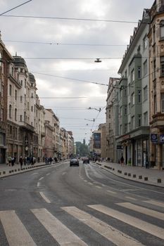 Urban street scene in Sarajevo, Bosna Hersek showcasing classic architecture and a busy city atmosphere.