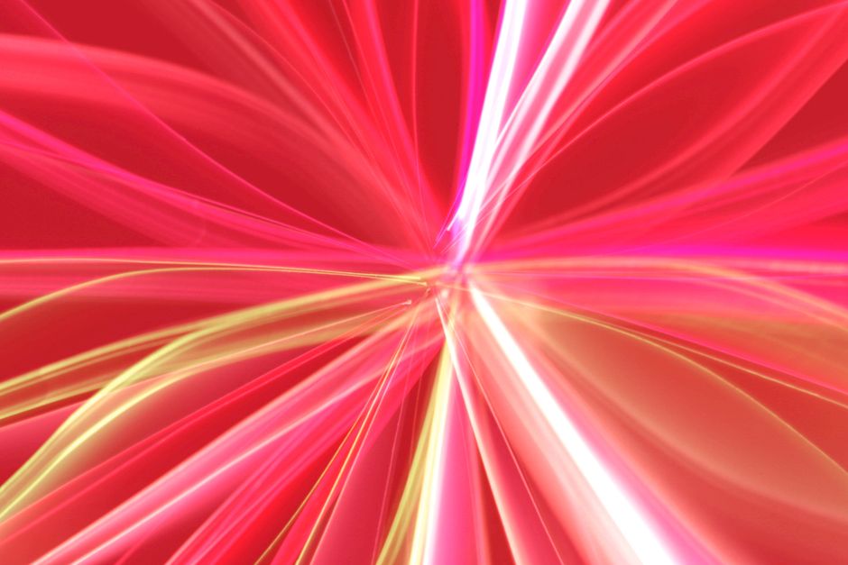 Dynamic red and pink abstract light streaks creating a vibrant, energetic pattern.
