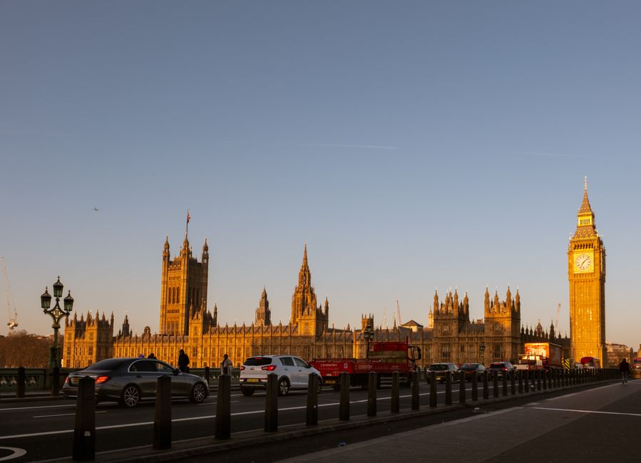 Golden sunset over Big Ben and Houses of Parliament, capturing iconic London skyline.