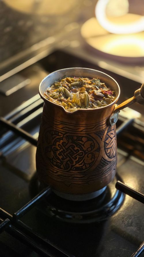 Free Close-up of Turkish coffee being brewed in a cezve on a stove, highlighting intricate design. Stock Photo