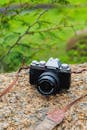 Vintage Fujifilm Camera on Stone Surface