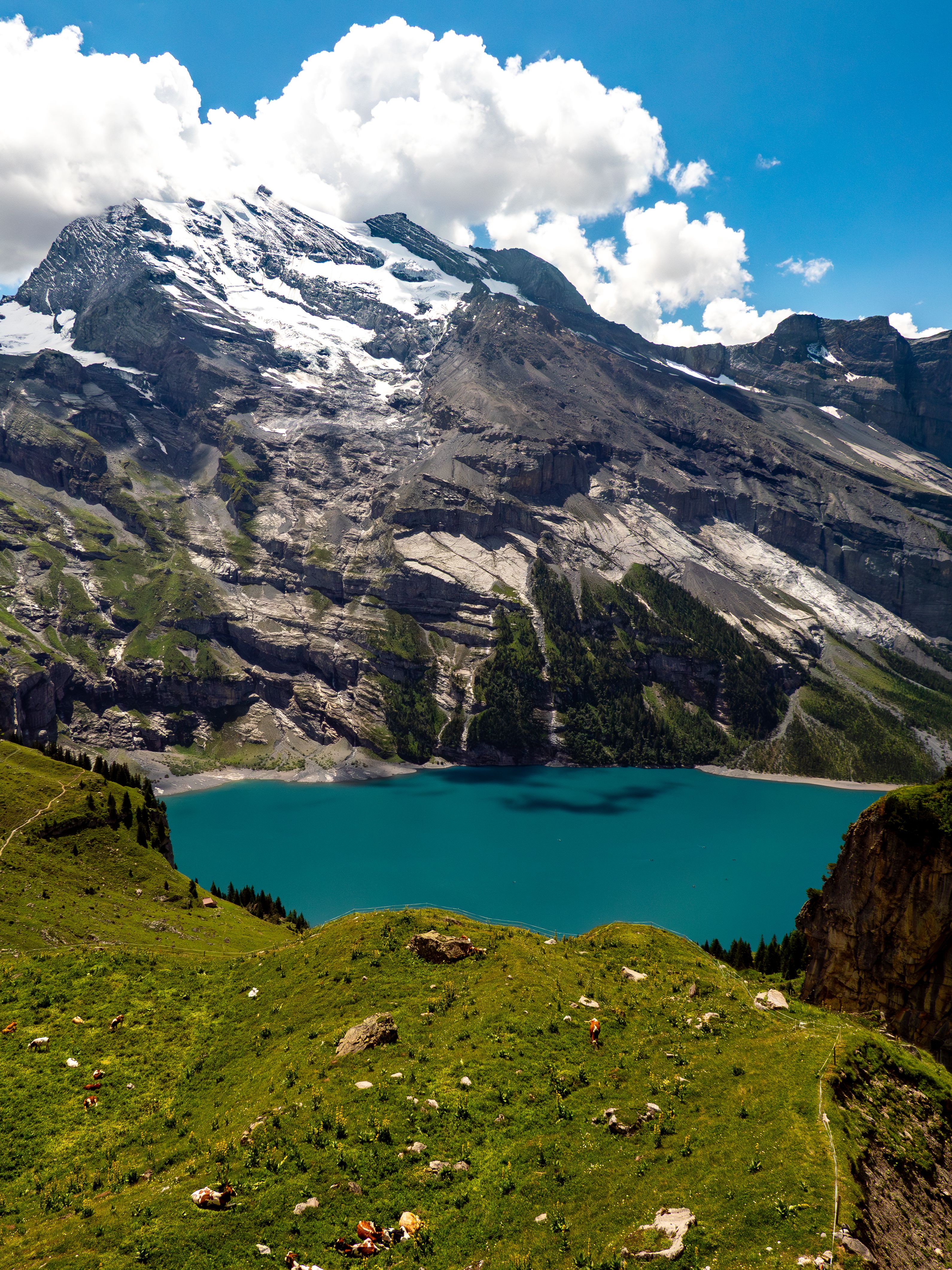 Mountain ridge and lake on cloudy day · Free Stock Photo