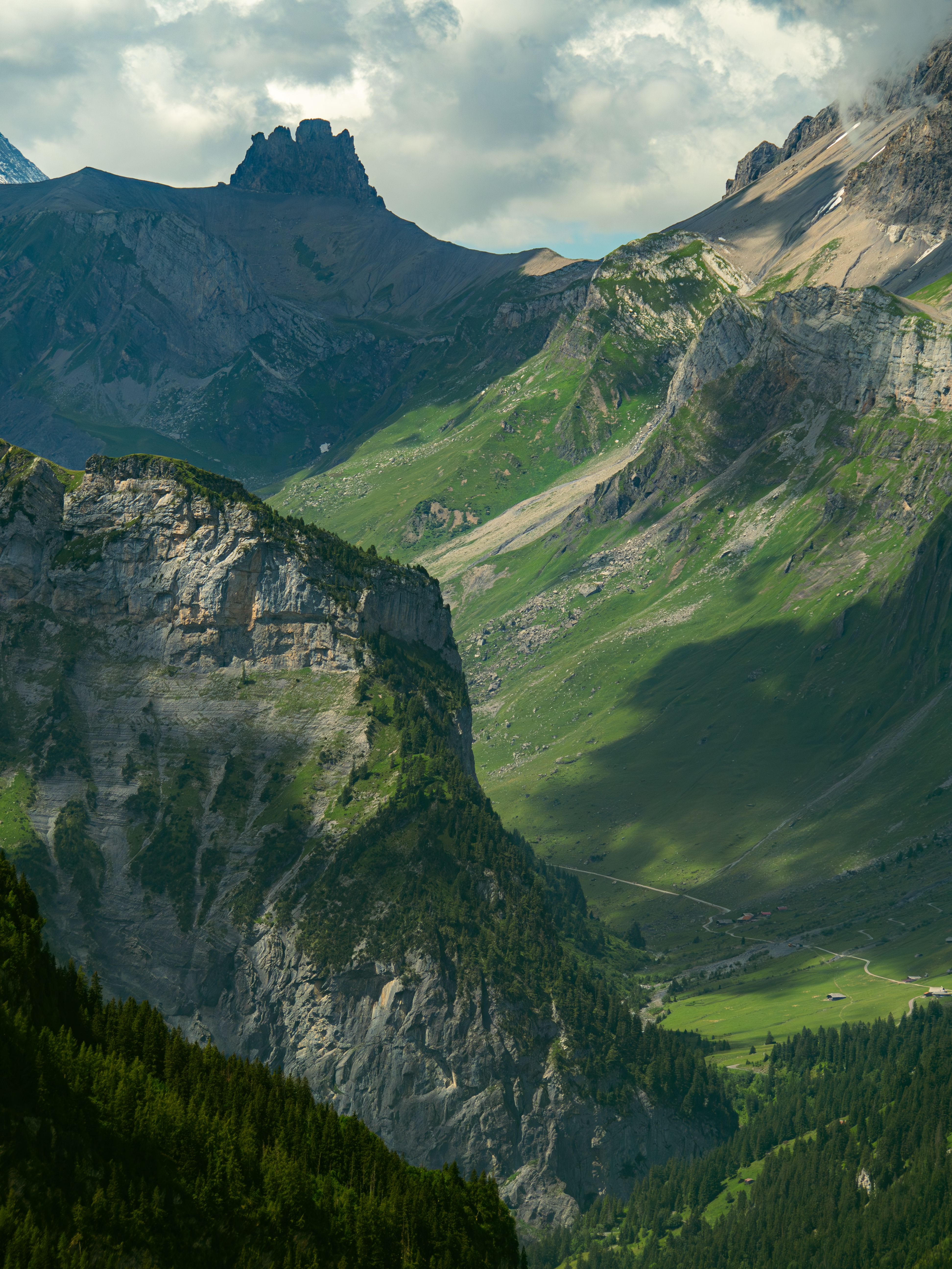 Breathtaking summer landscape of lush green mountains in Kandersteg, Bern, Switzerland.