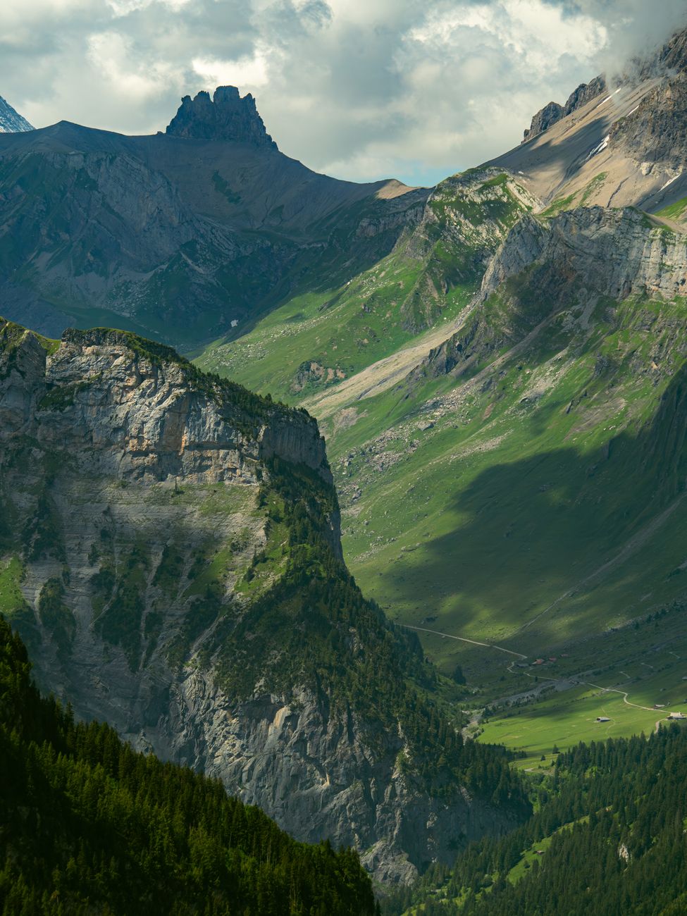 Sunlit mountains and a vast alpine valley