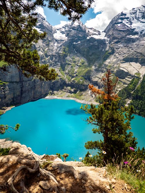 Mountain ridge and lake on cloudy day · Free Stock Photo