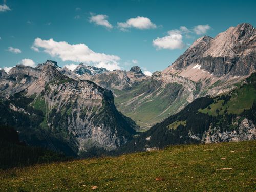 Free Breathtaking alpine landscape of Kandersteg, Switzerland with lush greenery and rugged mountains. Stock Photo