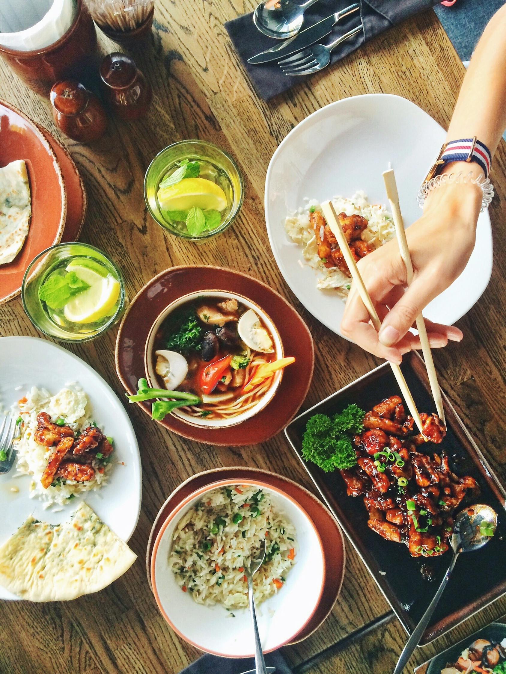 Person Eating Using Chopsticks