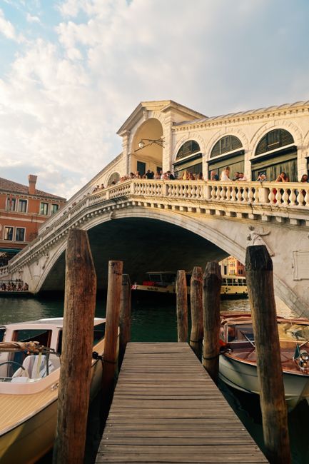 Explore the historic Rialto Bridge and vibrant Venice canal life. Ideal travel imagery.