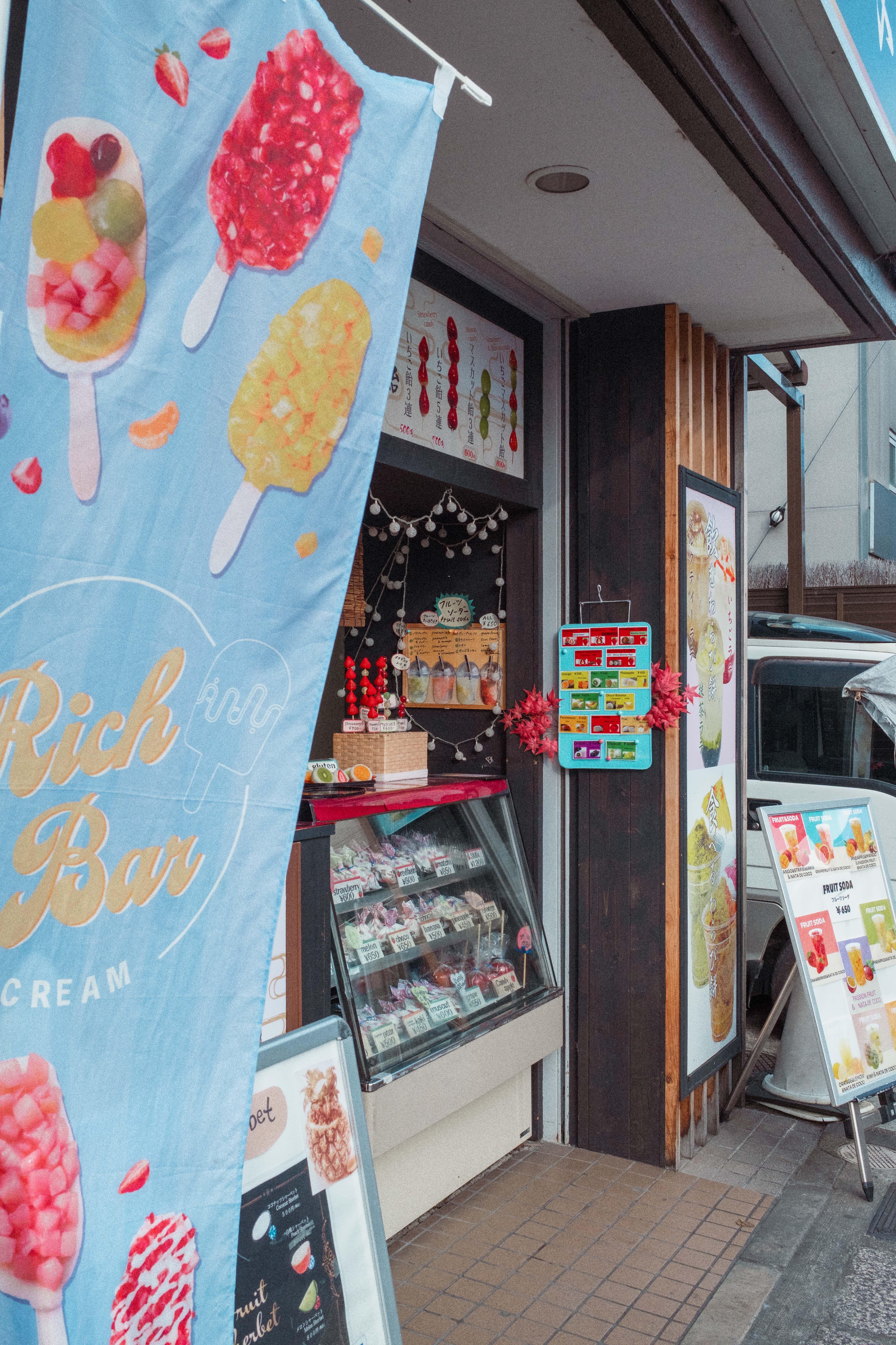 Colorful Ice Cream Shopfront with Popsicle Decor · Free Stock Photo