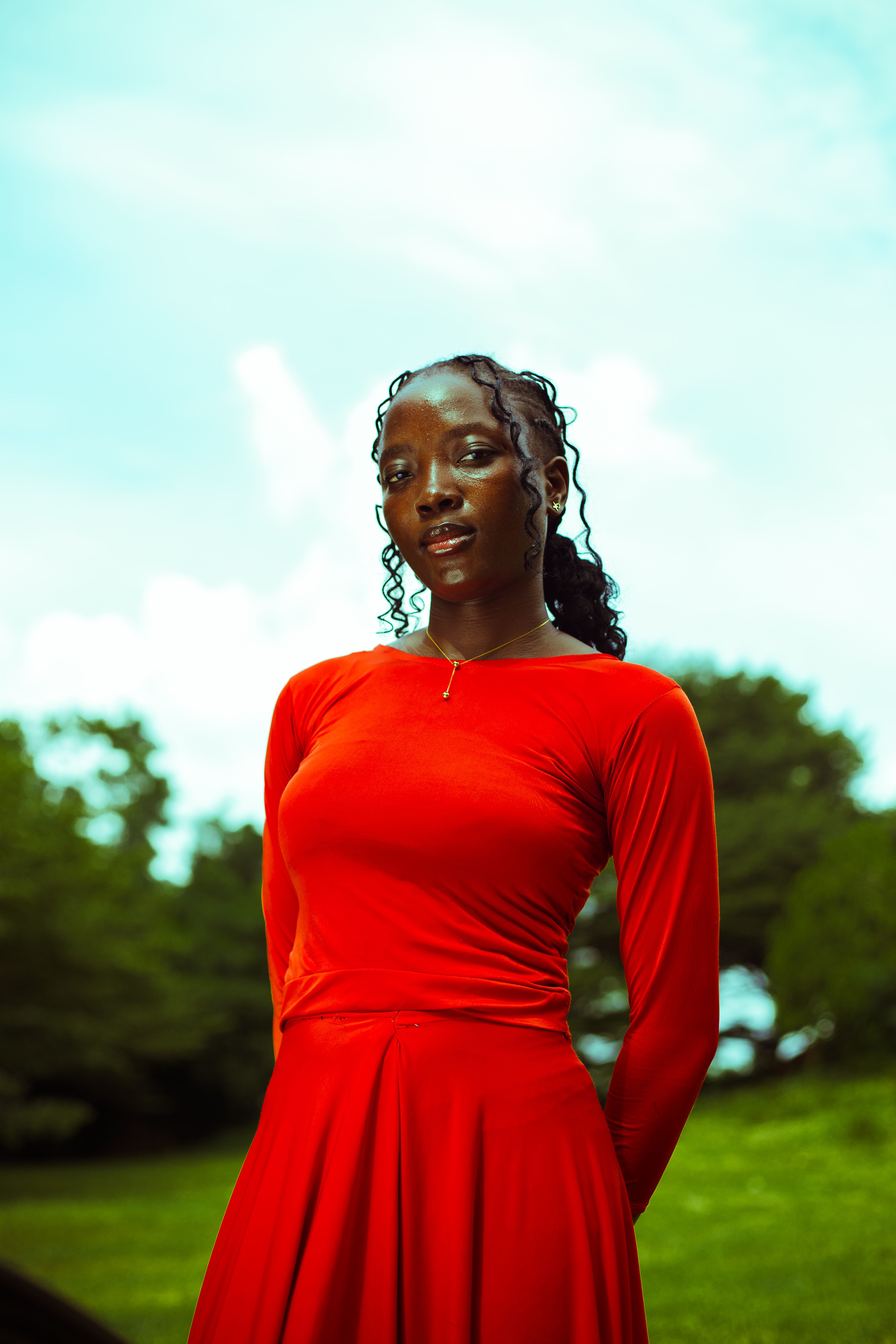 Elegant Woman in Red Dress Outdoors · Free Stock Photo