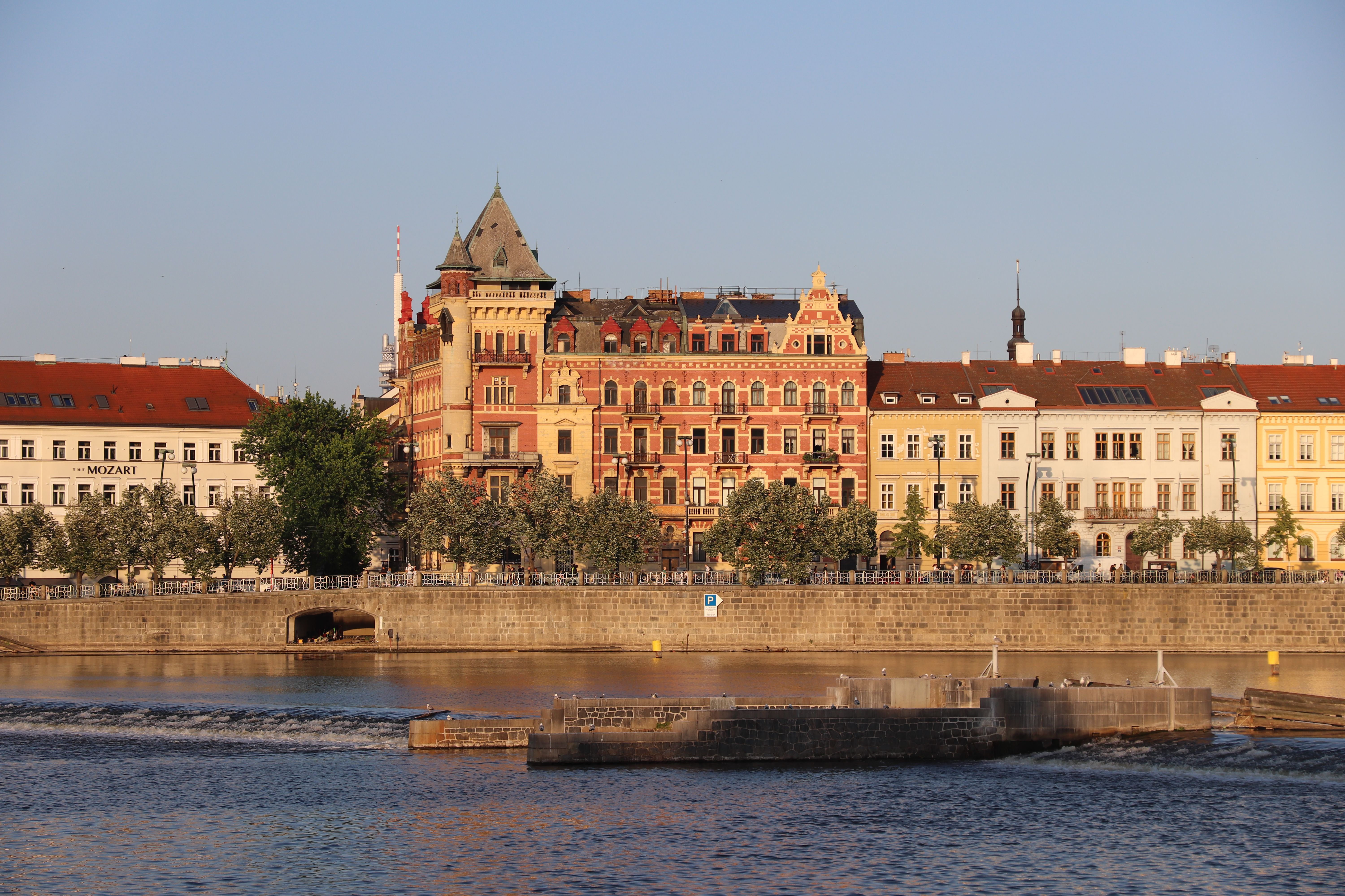 Colorful historic buildings by the Vltava River in Prague, Czech Republic.