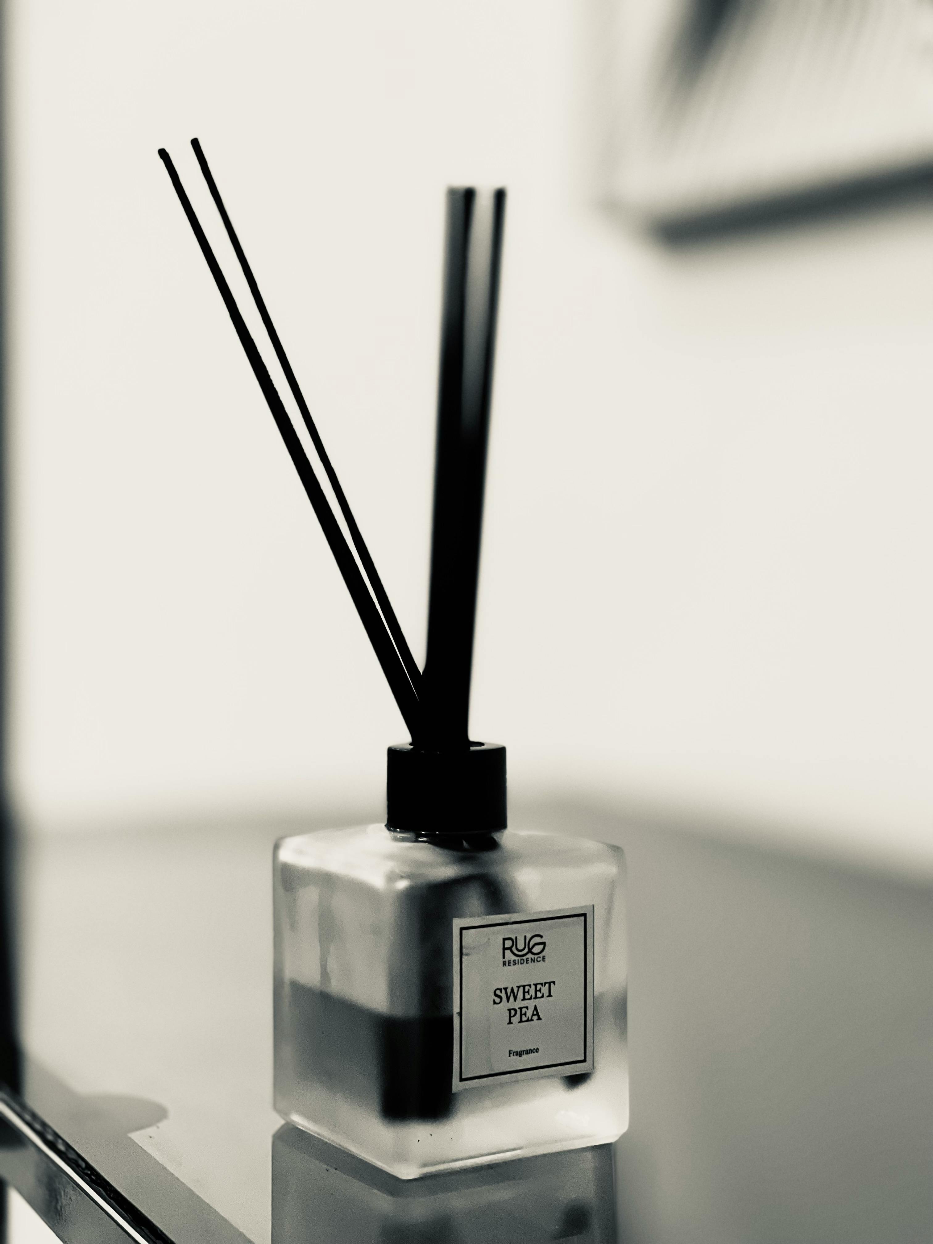 Elegant Reed Diffuser with Sweet Pea Fragrance · Free Stock Photo