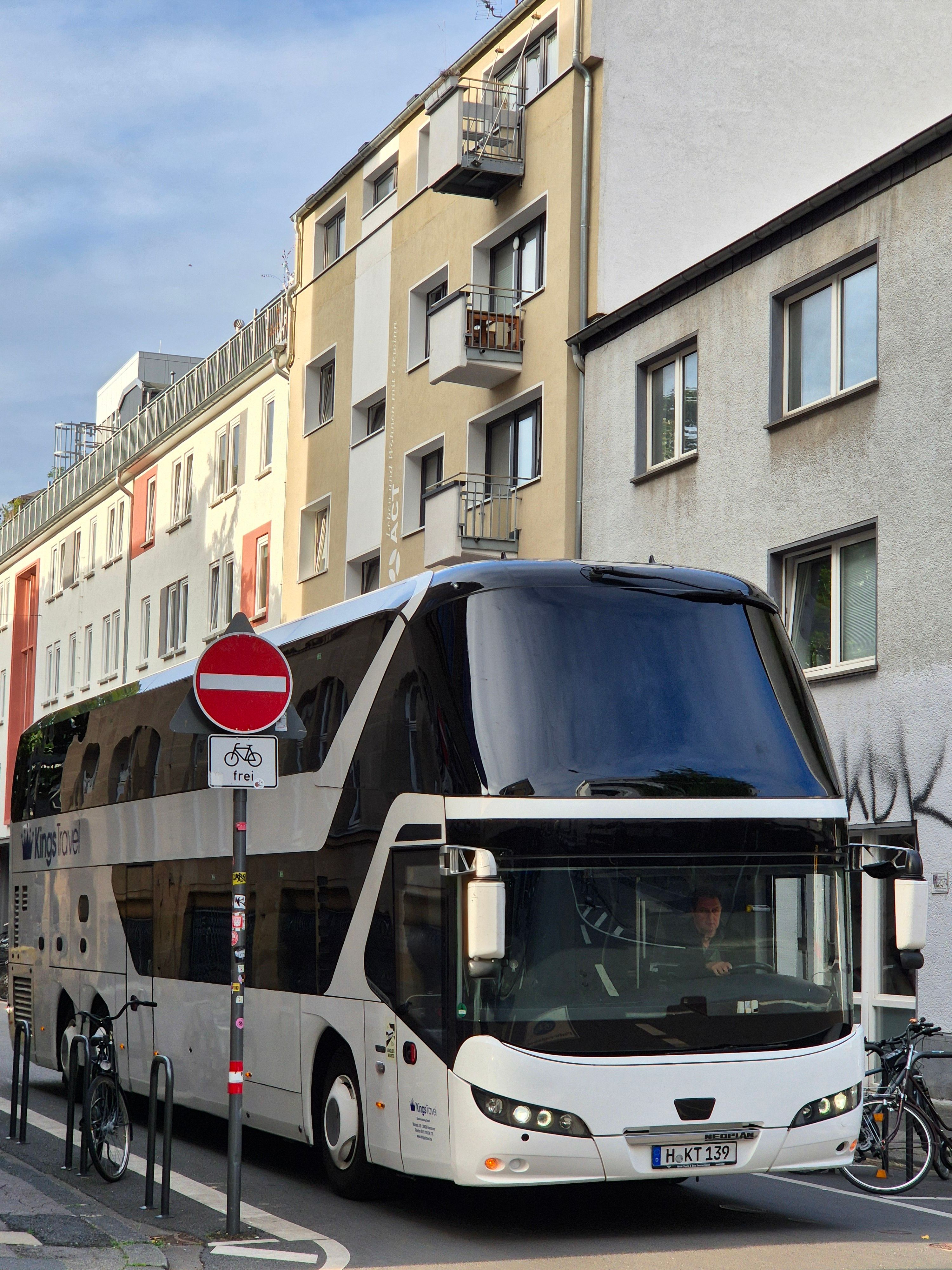 Modern Double-Decker Bus on Urban Street in Germany · Free Stock Photo
