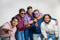 Group of Friends Posing in Casual Attire Indoors