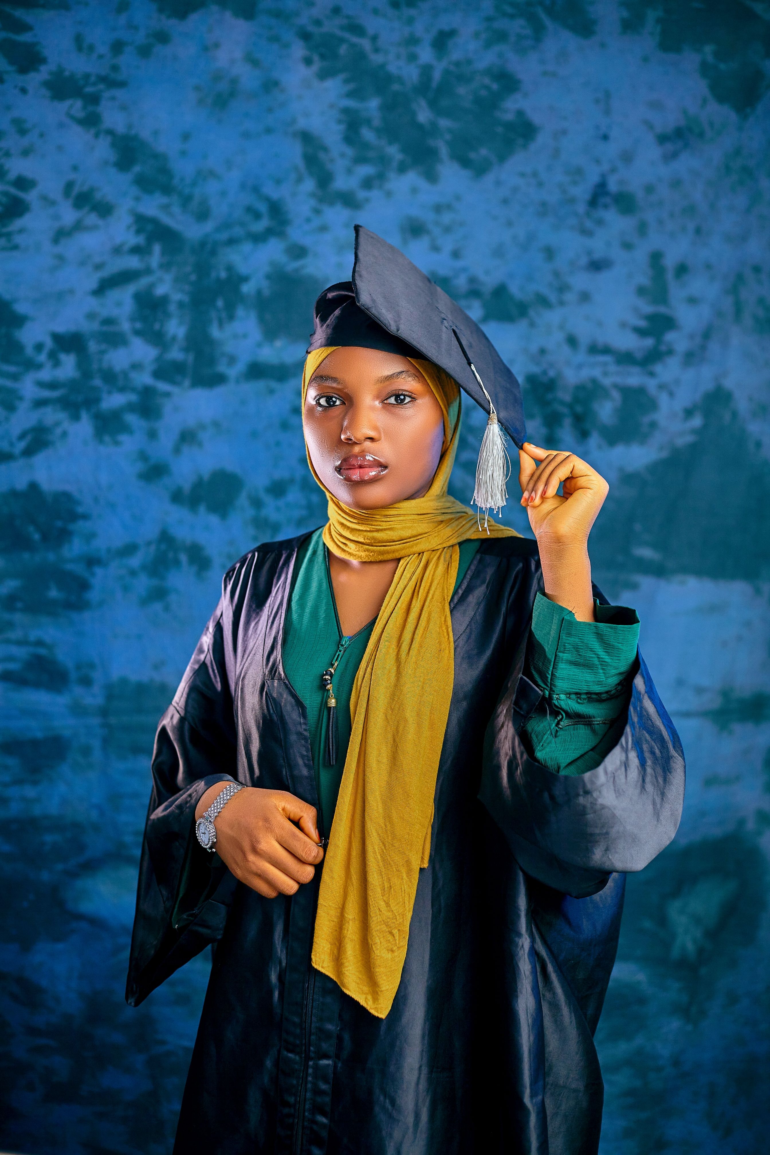 Confident Graduate in Cap and Gown · Free Stock Photo