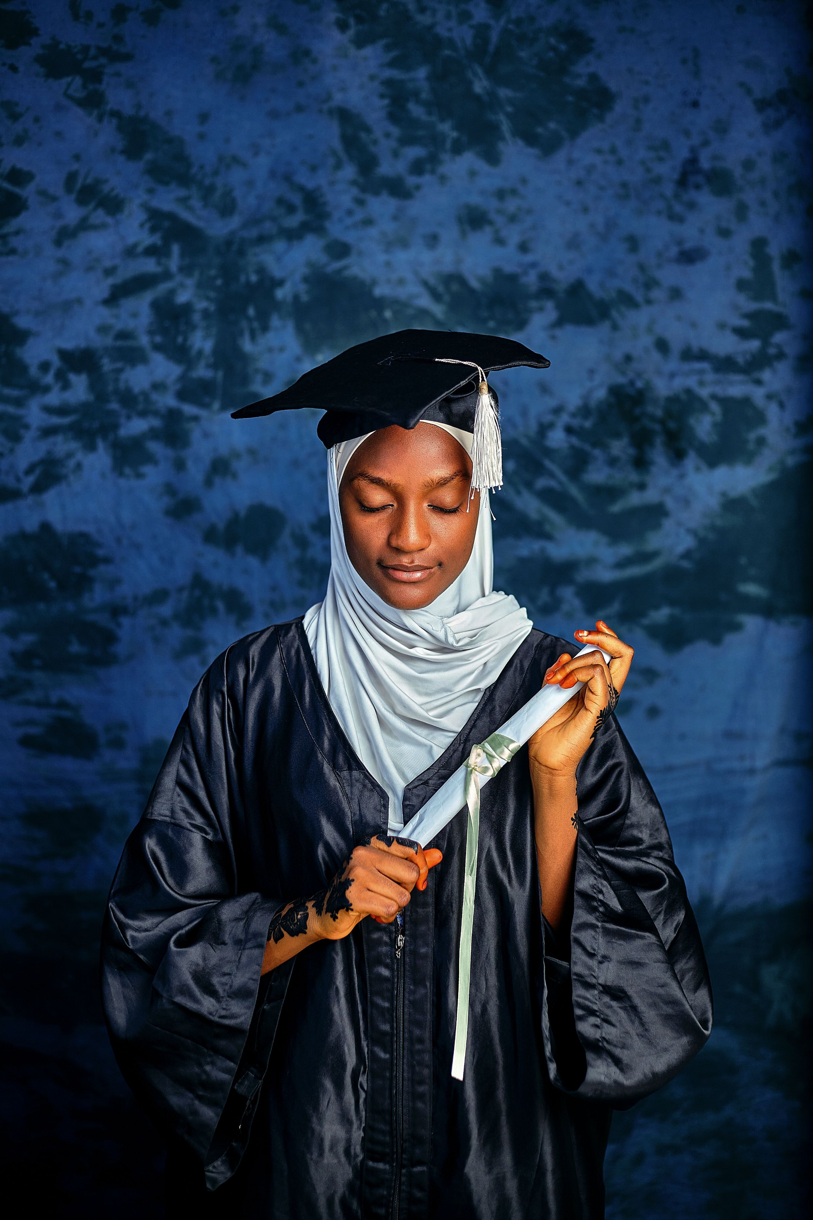 Young Graduate Posing with Cap and Gown · Free Stock Photo