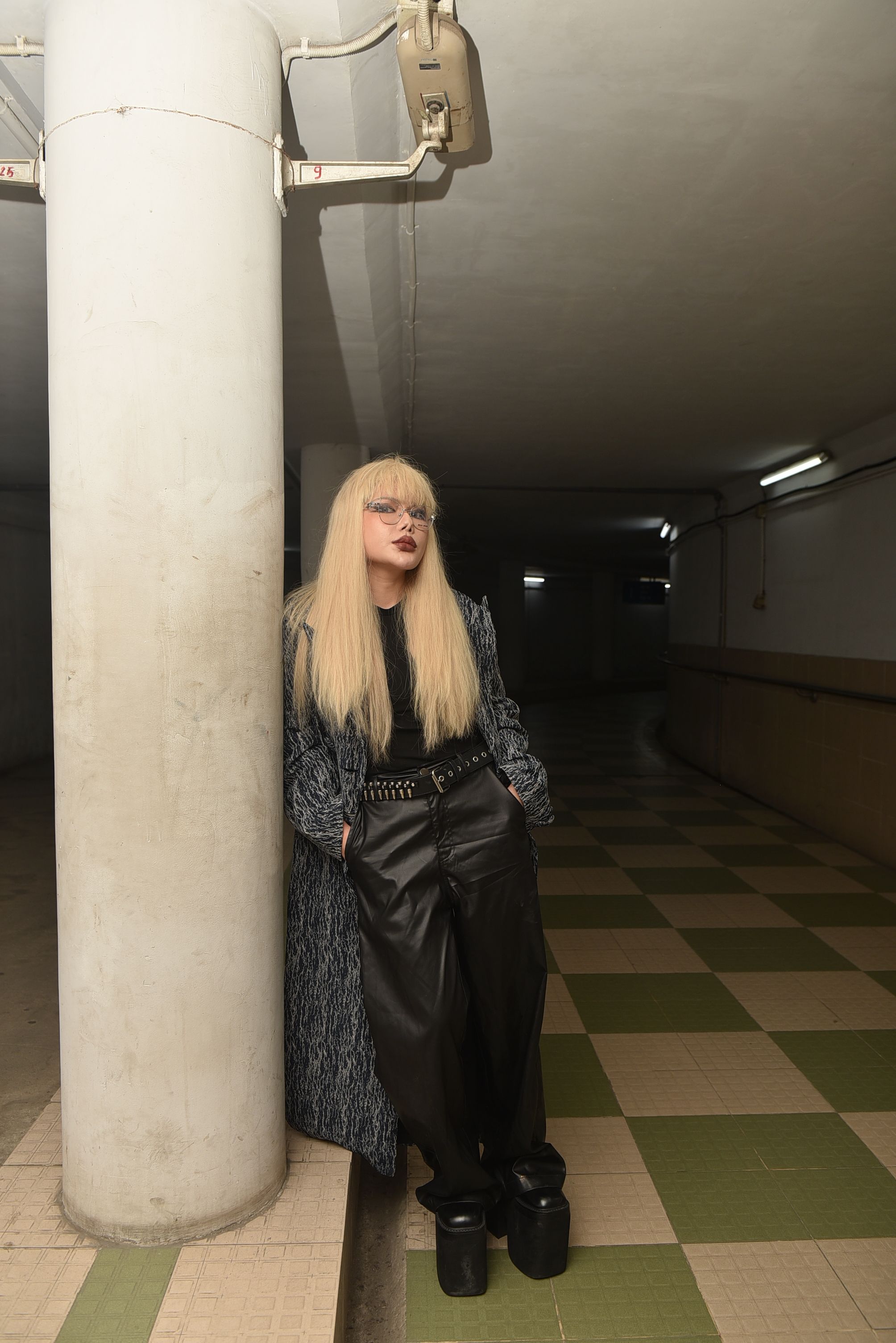 Stylish Woman Posing in Underground Corridor