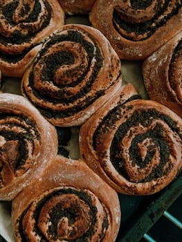 Close-up of delicious homemade poppy seed rolls, perfect for baking enthusiasts.