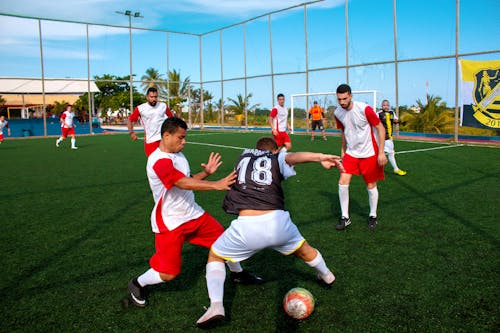 Free Group of Men Playing Soccer Stock Photo