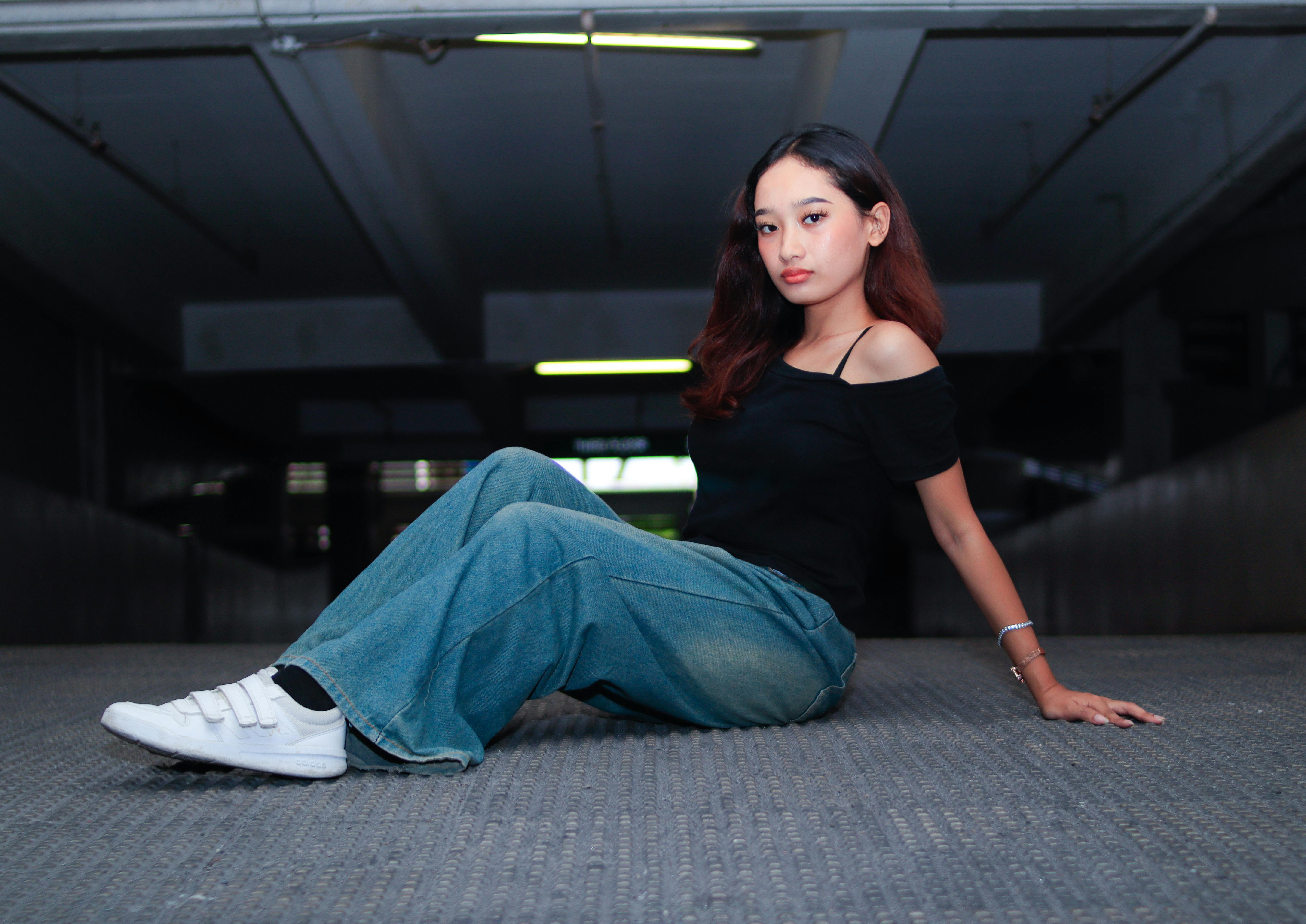 A pair of women jeans on a wooden chair
