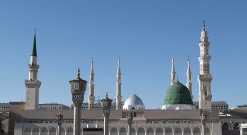 Free Stunning view of Al-Masjid an-Nabawi's minarets in Medina under blue skies. Stock Photo