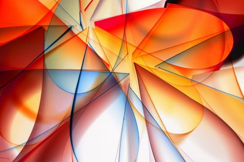 Free Colorful abstract art featuring overlapping geometric shapes in warm and cool tones. Stock Photo