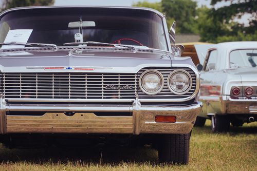 Free Vintage Chevrolet Impala on display at an outdoor car show in summer. Stock Photo
