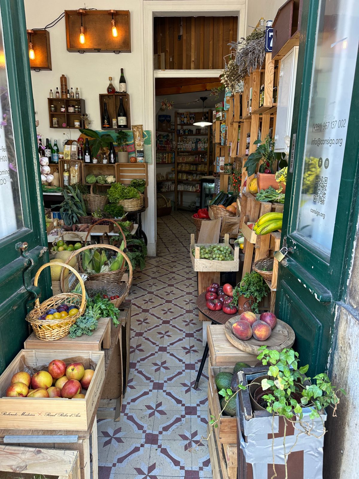 A small organic grocery shop in Lisbon with produce in wooden crates