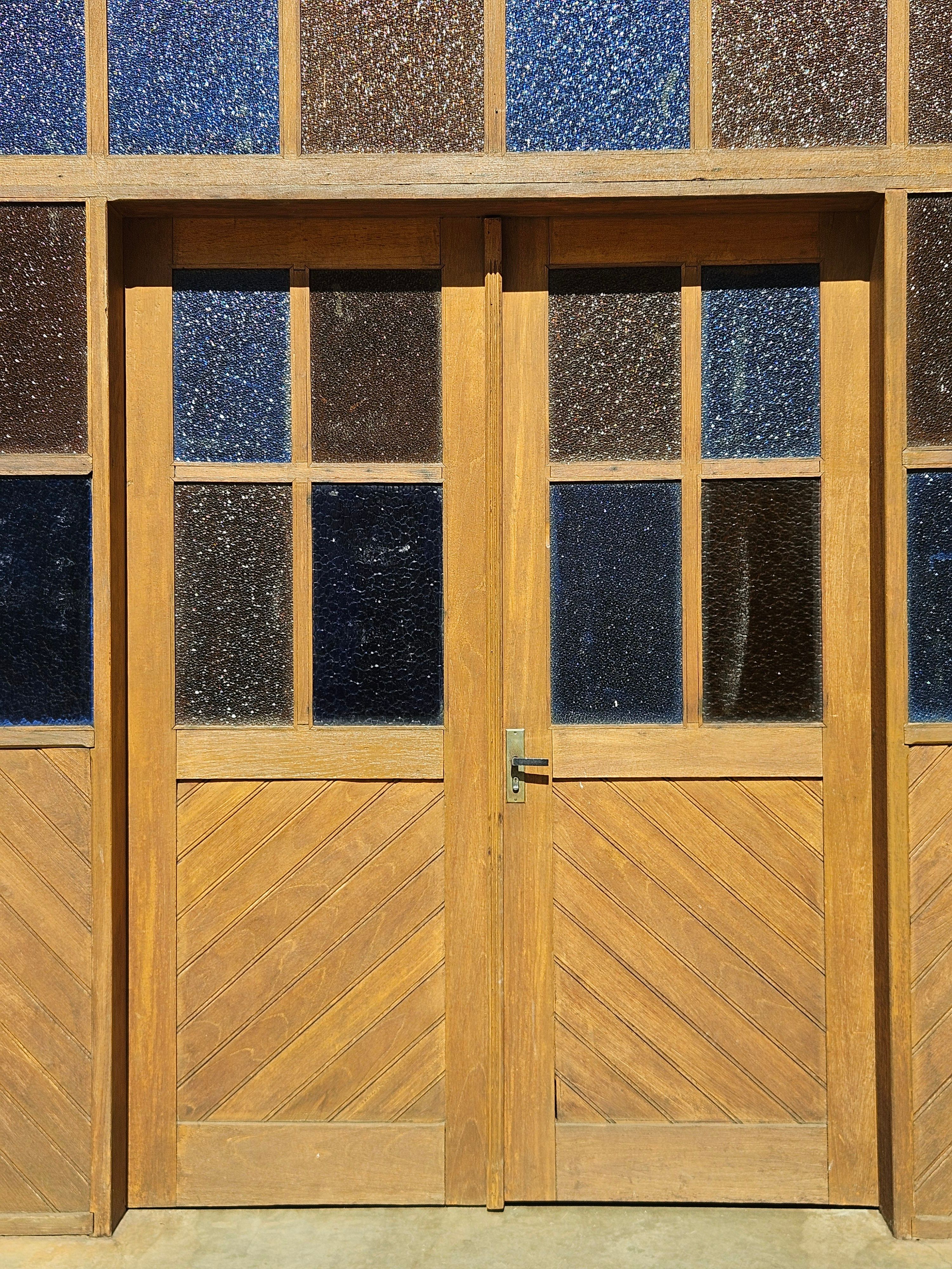 Image showcasing Wooden Door with Textured Glass Panels · Free Stock Photo