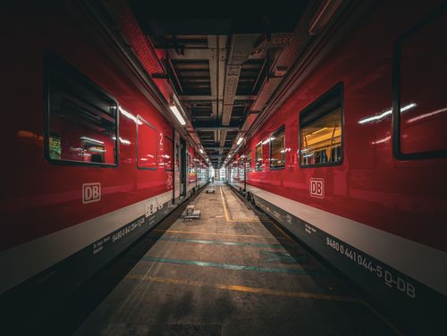 Free Captivating view of red Deutsche Bahn trains inside a workshop in Munich, showcasing industrial design. Stock Photo