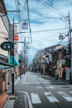 Idyllic street view in Japan with traditional architecture and scenic urban setting.