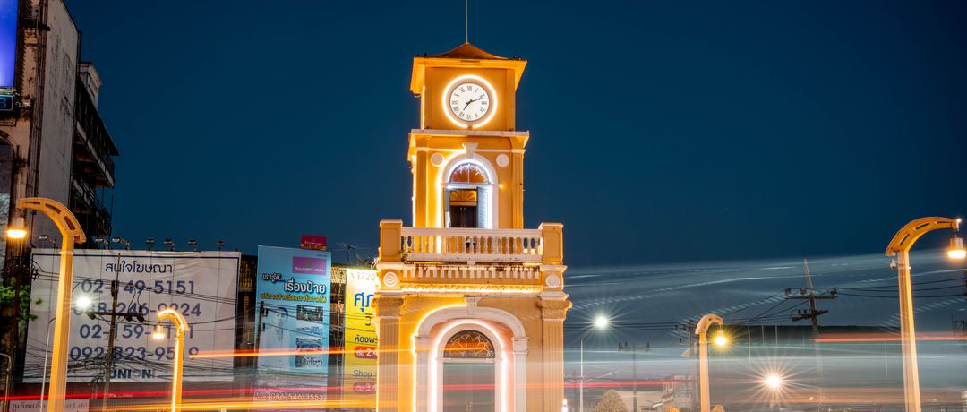 Night view of the illuminated Phuket Clock Tower with vibrant light trails, Phuket, Thailand, stay connected here with a travel eSIM