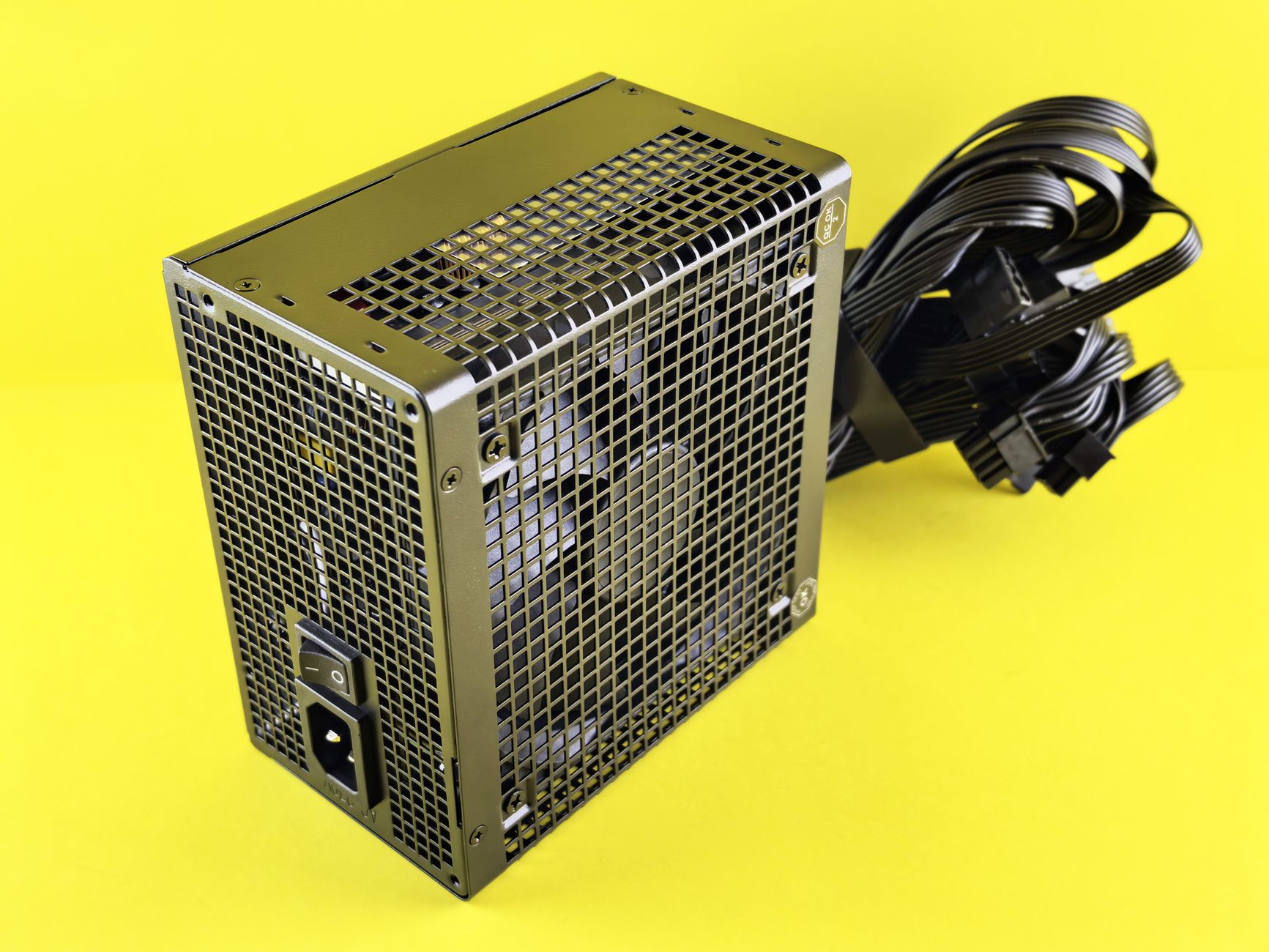 A powerful gaming PSU on yellow background, ideal for desktop setups.