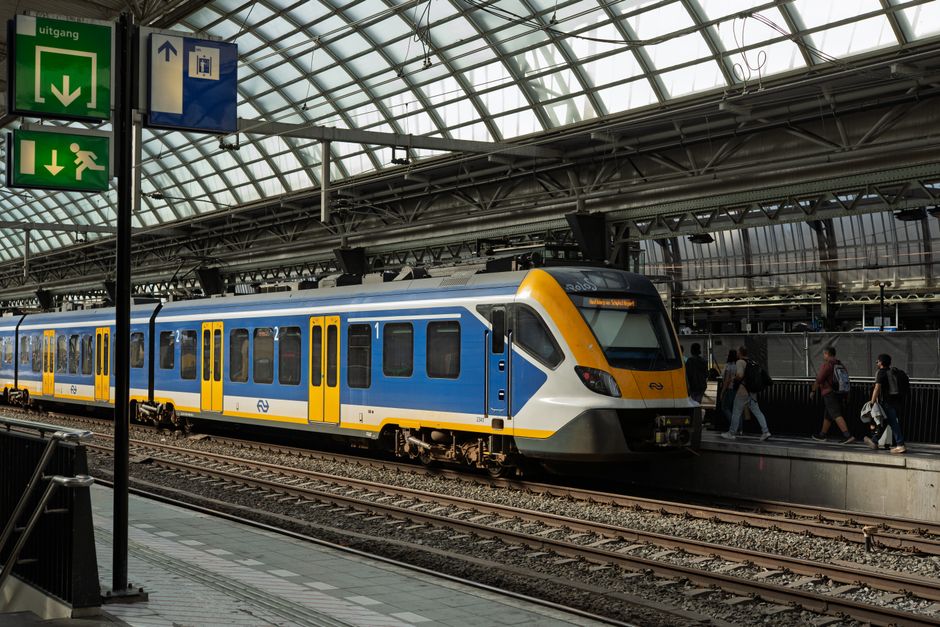 Train platform at Amsterdam Schiphol Airport with an NS train in the Netherlands