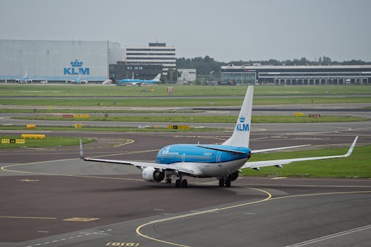 KLM airplane on the runway at Amsterdam Airport, offering a glimpse of international aviation and travel.