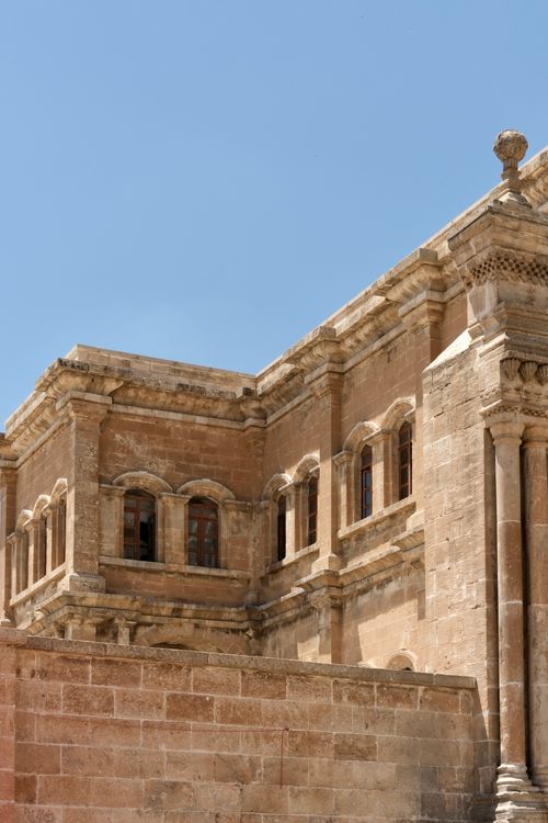 Free Elegant historic stone architecture with blue sky backdrop, exuding timeless beauty. Stock Photo