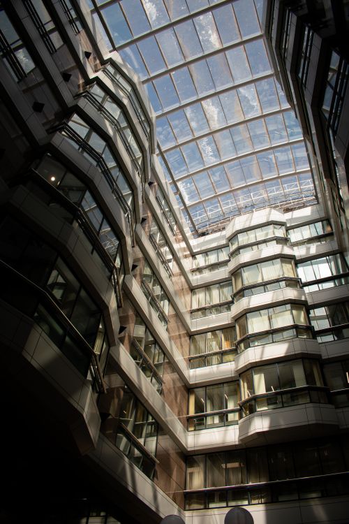 Free Spacious indoor atrium with a glass roof in a modern building in Birmingham, UK. Stock Photo