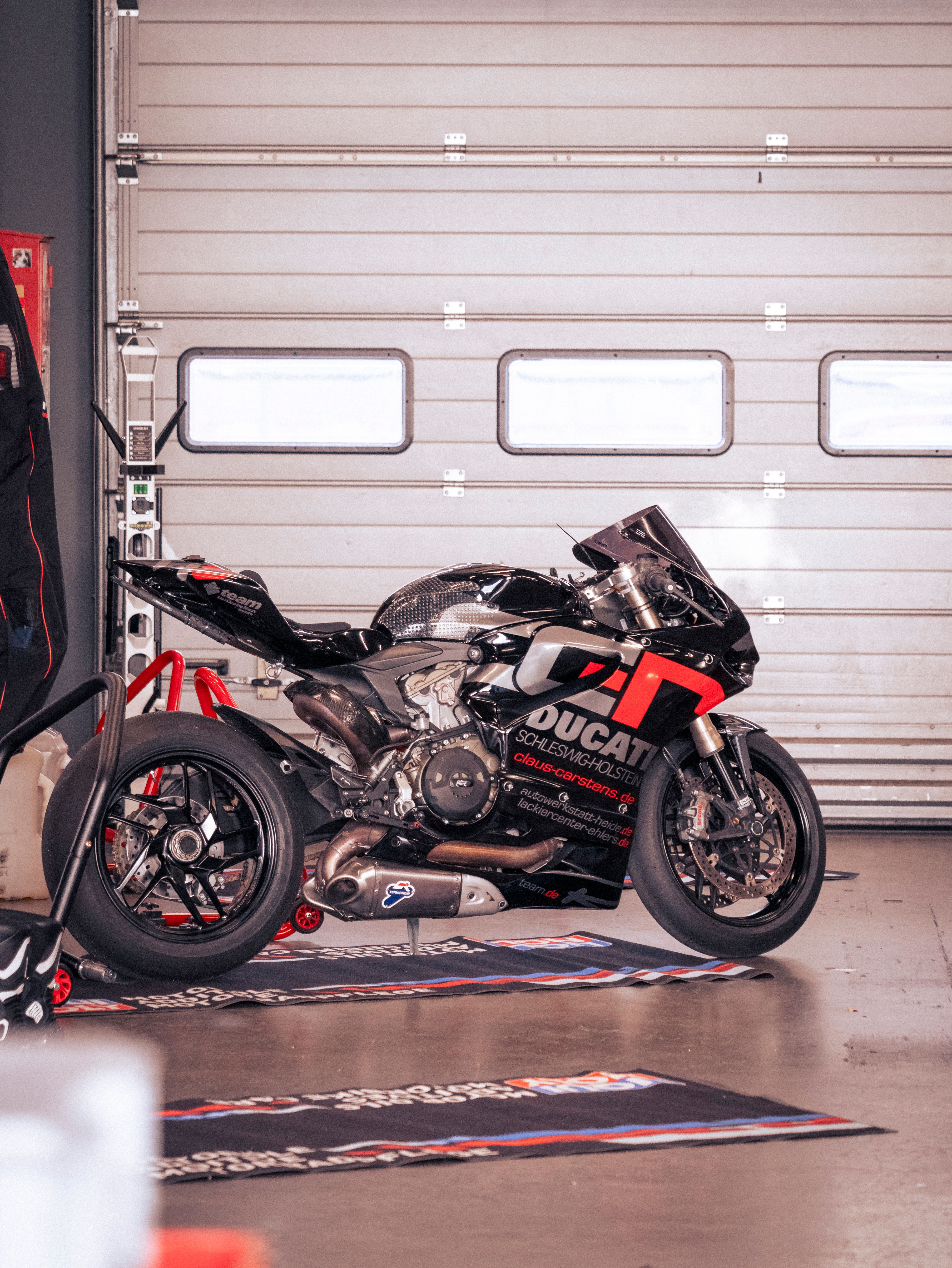 Ducati Racing Motorcycle in Nürburg Garage · Free Stock Photo