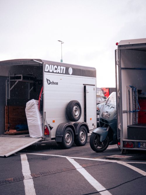 Free Ducati motorbike being transported in a trailer at Nürburgring. Stock Photo