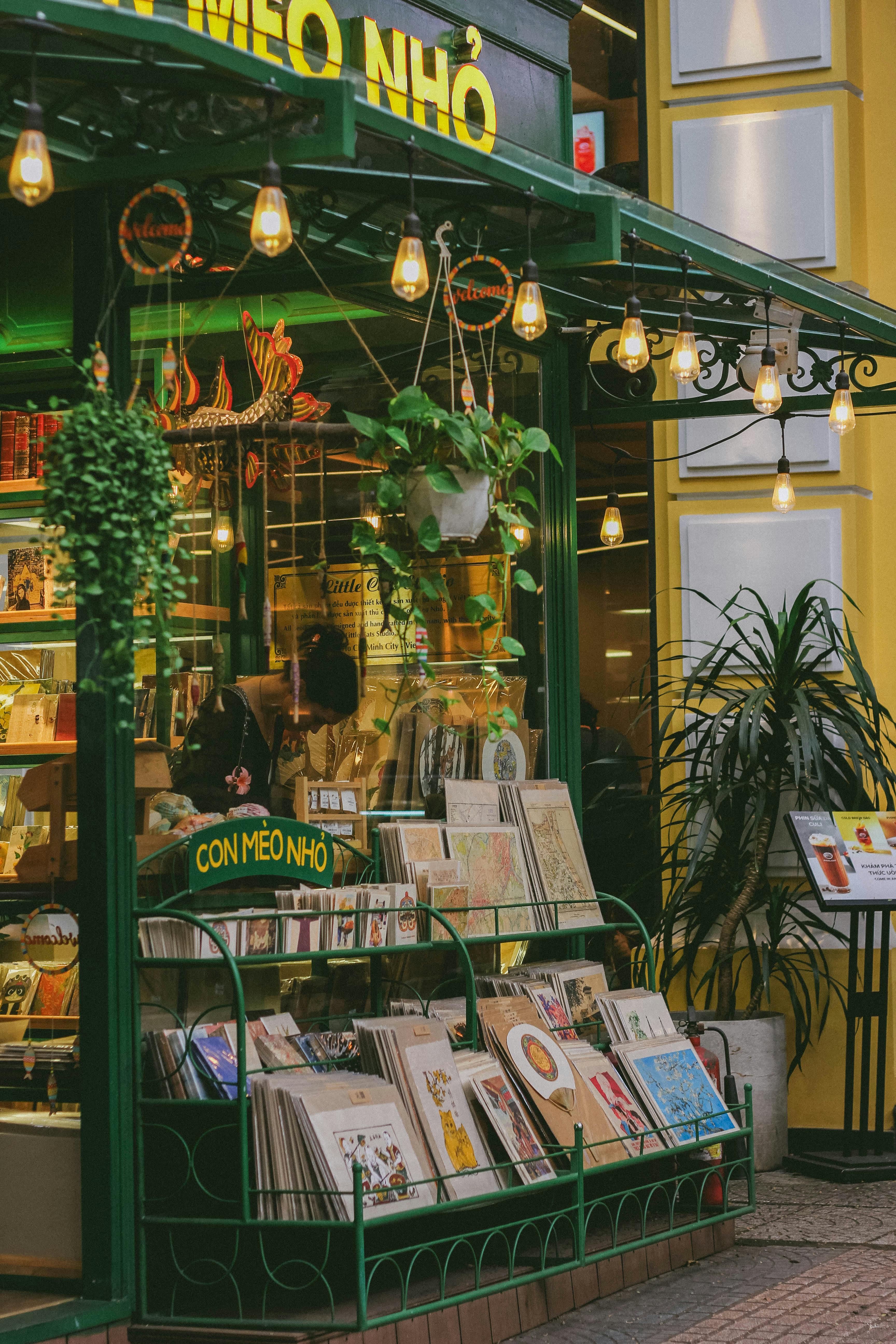Explore a cozy bookshop with warm lighting and quaint decor in Ho Chi Minh City, Vietnam.