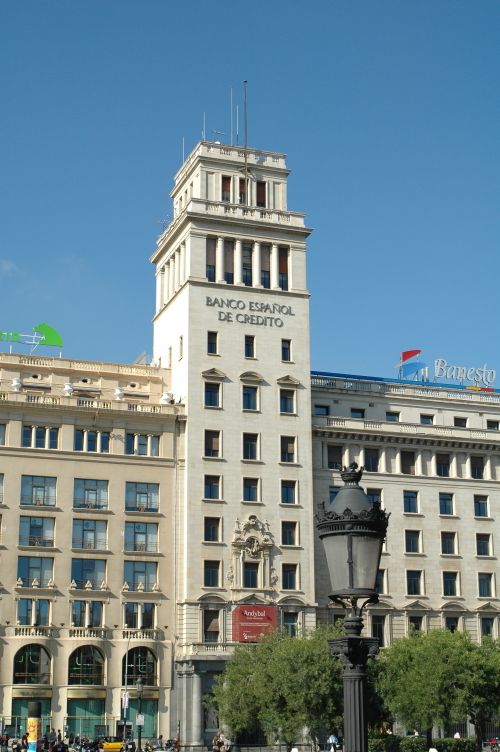 Free A classic view of the Banco Español de Crédito building in Barcelona, showcasing unique architecture. Stock Photo
