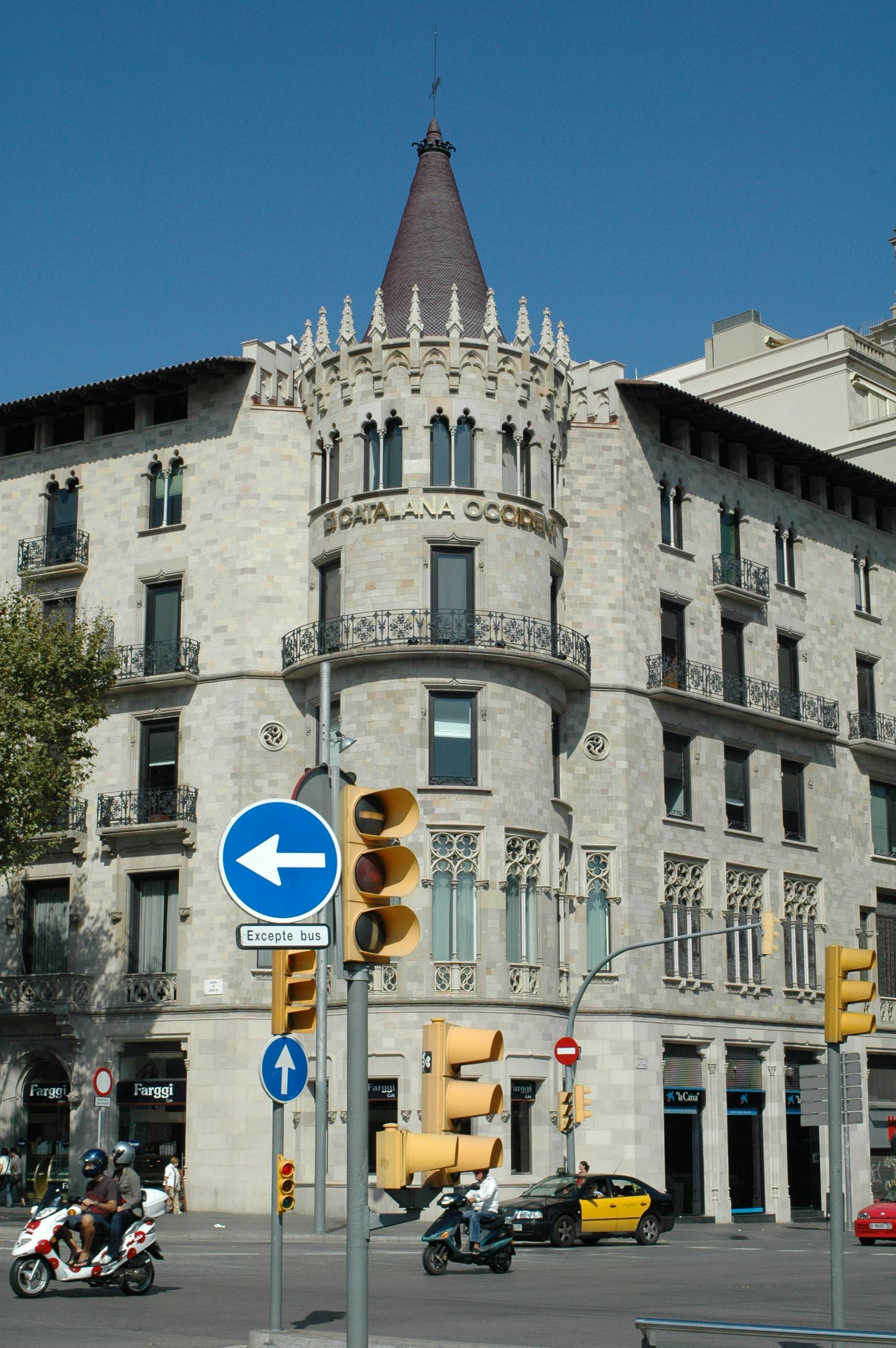 Architectural photo of a Gothic-style building in Barcelona, Spain, captured during the day.