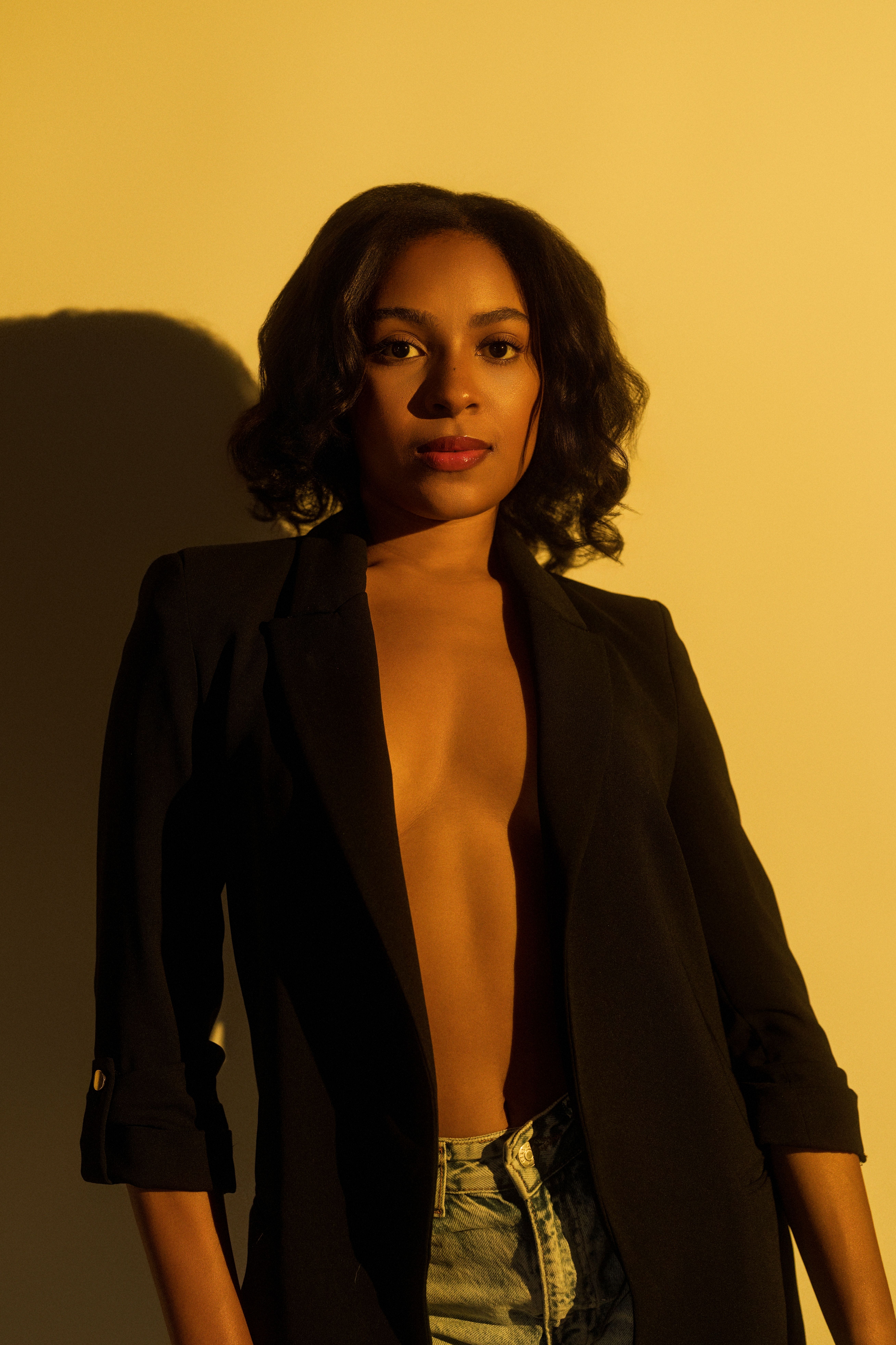 Striking portrait of a woman in bold lighting with a sophisticated style, evoking elegance.