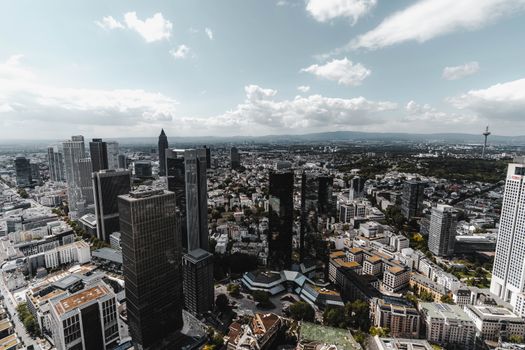 Stunning aerial view showcasing Frankfurt's skyline with modern skyscrapers and clear blue skies.